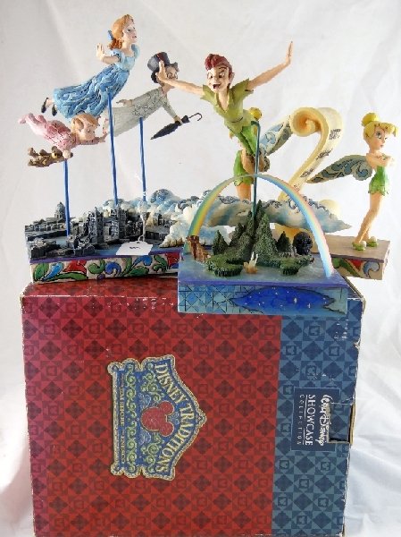 Lot of (3) Enesco Peter Pan Figurines: "Tinkerbell: Have You Been Naughty or Nice"/"The Darling Family: Straight On Til Morning" *In Original Box*/"Peter Pan: Soars to the Stars". All of the pieces are in great condition.