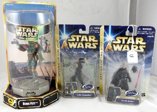 (3) Collectible Star Wars Figurines *In Box*: The lot includes "Darth Vader", "Luke Skywalker", & "Boba Fett". All of the figurines are new in the original box.