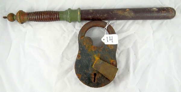 Antique Police Night Stick & Jail Lock: Antique Police Night Stick & Jail Lock. The night stick is approx. 20" & is made of wood. The padlock is approx. 8" & crafted from heavy iron. Swing the brass keyhole cover to the side to access the k
