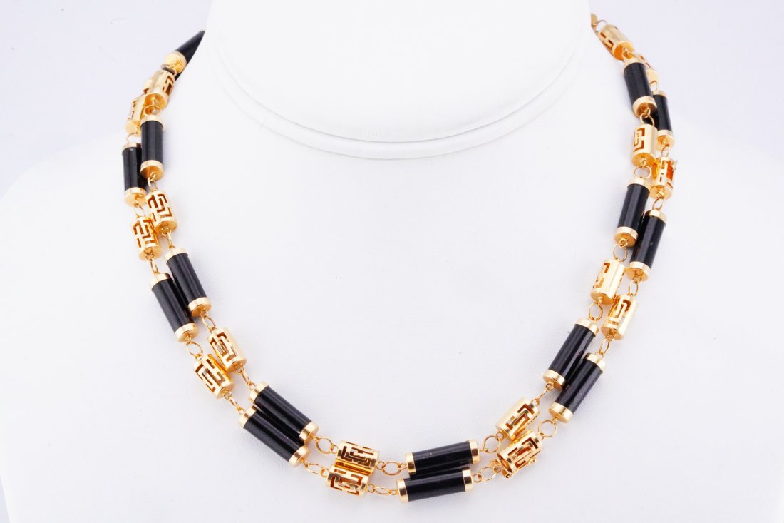 Bibi Hilton's 14K Yellow Gold and Onyx 32" Necklace: Bibi Hilton's 14K Yellow Gold and Onyx 32" Necklace (From the Estate of Mrs. Bibi Hilton) - This lovely 14k yellow gold and onyx barrel-link necklace was owned by Mrs. Bibi Hilton. This piece was worn
