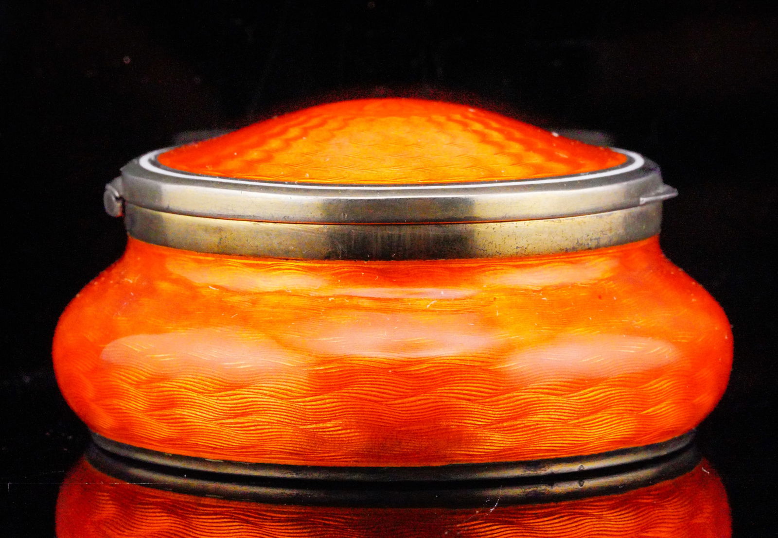 Orange Guilloche Enamel and Silver Powder Box: Orange Guilloche Enamel and Silver Powder Box W/Gold washed Interior - This gorgeous piece is made of silver and is finished with an absolutely stunning burnt orange guilloche enamel. The interior of