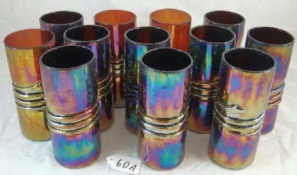12 Esteban Prieto Carnival Glass Tumblers: Lot of (12) Esteban Prieto Irridescent Carnival Art Glass Tumblers. All of the glasses are signed. These are beautifully colorful & are in great condition. Approx. 6" Est. value $400-450.