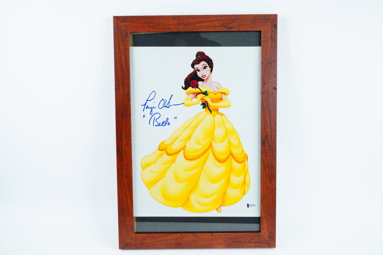 Paige O'Hara "Belle" Signed 11" x 14" Photo W/COA: Paige O'Hara "Belle" Signed 11" x 14" Photo W/Beckett Authentication (Framed) - This photograph depicts the iconic animated character "Belle" from the 1991 Walt Disney animated film, Beauty and the Be