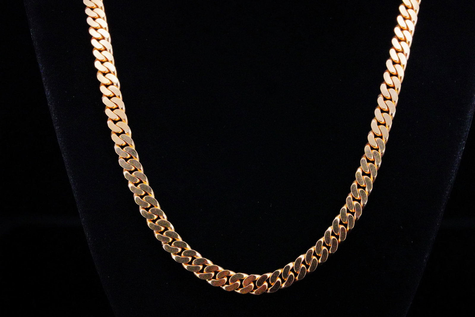 18K Yellow Gold 6.2mm Wide 24" Cuban Link Necklace: 18K Yellow Gold 6.2mm Wide 24" Cuban Link Necklace - This Cuban link necklace is crafted in 18k yellow gold and has a heavy and luxurious feel. The chain measures 6.2mm wide and 24 inches in length, a