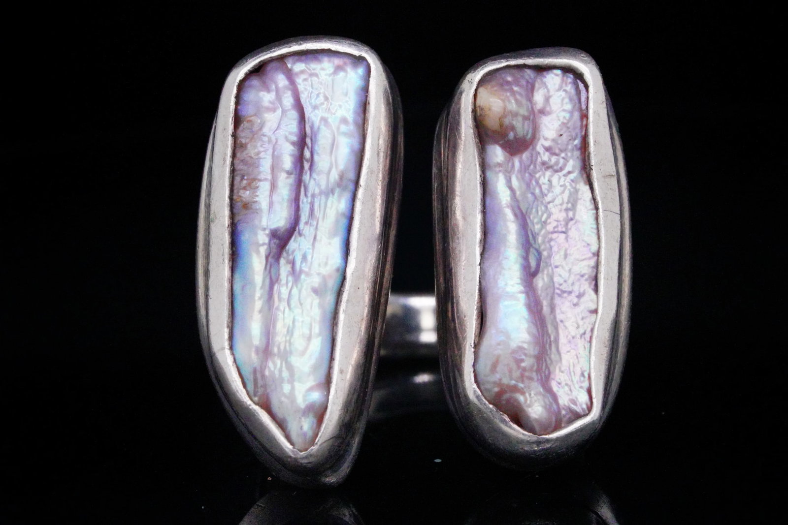 Sterling Silver and Baroque Pearl Bypass Ring: Sterling Silver and Baroque Pearl Bypass Ring - This ring is crafted in sterling silver and features two iridescent baroque pearls. Ring size: 9. Condition: Overall very good estate condition with lig