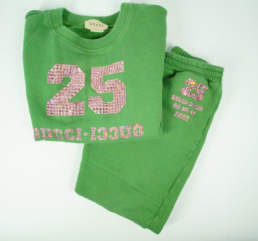 Gucci Children's 1921 Green Cotton Jogging Set: GUARANTEED AUTHENTIC. Gucci Children's 1921 Green Cotton Jogging Set - The Gucci Children's 1921 Green Cotton Jogging Set is a relaxed outfit crafted from felted cotton jersey and defined by a Gucci i