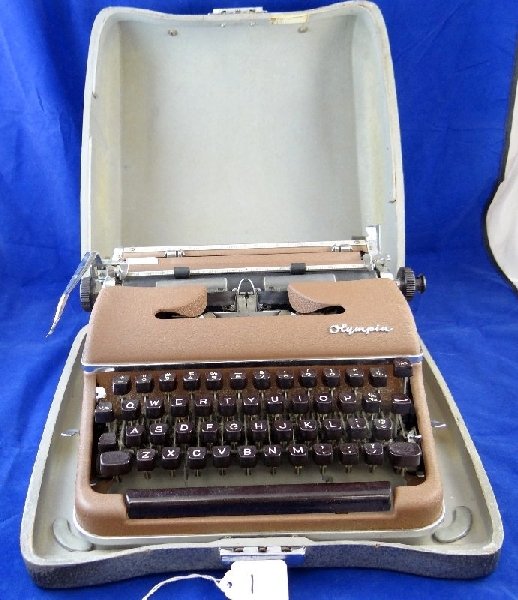 Vintage Olympia Werke De Luxe Typewriter: This Typewriter was made in western Germany in the 1950s & still works it measures approximately 14"x14"