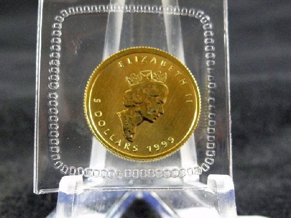 $5 Canadian Gold Maple Leaf .9999 pure gold: 1999 $5 Canadian Gold Maple Leaf .9999 pure gold-20th Anniversary *SEALED*. This is the same as a proof strike, and is still sealed in the original protective plastic from the mint. This is the most s