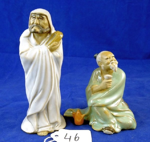 (2) Vintage Porcelain Chinese Figurines: These (2) figurines are in great condition & feature (1) man sitting down drinking from cup & other standing with long white robe measure approx. 4"-6"