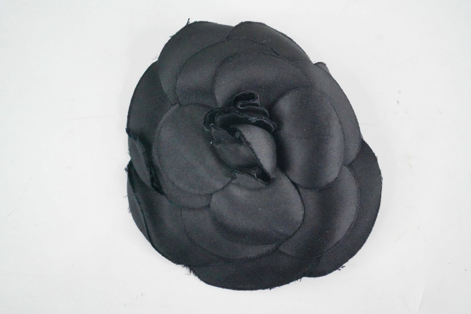 Arlene Dahl's Chanel Large Black Silk Camellia Pin: Arlene Dahl Personally Owned Vintage Chanel Large Black Silk Camellia Pin W/LOA - This remarkable auction lot features a vintage Chanel large black silk camellia pin personally owned by the iconic act