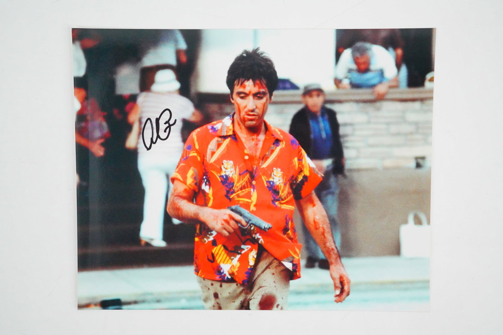 Al Pacino Autographed "Scarface" Photo W/COA: Al Pacino Autographed "Scarface" Photo W/COA - This Al Pacino autographed Scarface photo is an iconic collectible for fans of the legendary actor and the cult classic film. The image captures Pacino i