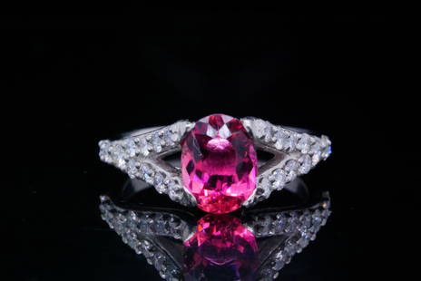 1.25ct Pink Tourmaline, 0.60ctw Diamond, Platinum Ring: 1.25ct Pink Tourmaline, 0.60ctw VS2-SI1/G-H Diamond and Platinum Ring - This ring is crafted in platinum and boasts a beautiful 1.25ct (approximate) oval cut pink tourmaline. The ring features a