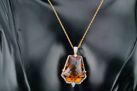 30.00ct Citrine, 1.00ctw Diamond and 14K Pendant: 30.00ct Citrine, 1.00ctw SI1-SI2/G-H Diamond and 14K Yellow Gold Pendant on Gold Filled Chain - This necklace features a 1.5" 14k yellow gold pendant, boasting a stunning 30.00ct (approximate) citrine