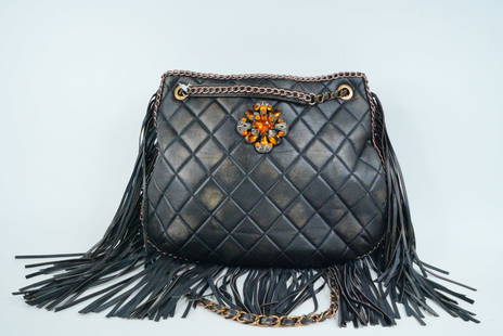 Chanel 2014 Black Aged Calfskin Fringe Shoulder Bag: Chanel 2014 Black Aged Calfskin Fringe Shoulder Bag - Step into timeless Parisian elegance with this stunning Chanel 2014 Fringe Shoulder Bag, a coveted piece that fuses classic luxury with bohemian f