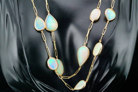 170.00ctw Opal and 14K Yellow Gold 36" Necklace: 170.00ctw Opal and 14K Yellow Gold 36" Necklace - This necklace features a 14k yellow gold paperclip style chain lined with approximately 170.00ctw faceted opals. These are solid high quality opals (n