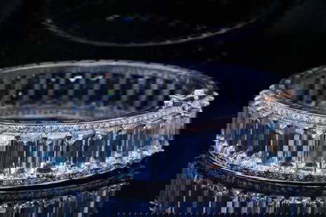 85.50ctw Aquamarine, 3.25ctw Diamond, Silver Bracelet: 85.50ctw Aquamarine, 3.25ctw Diamond and Silver Bangle Bracelet - This bangle is crafted in silver and is lined with approximately 85.50ctw emerald cut aquamarines. The bangle is also lined with appro