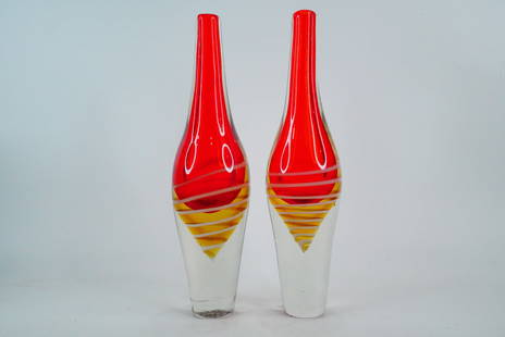 Pair of Murano-Style Handblown Art Glass Vases: Pair of Murano-Style Handblown Art Glass Vases - This is a vibrant pair of Murano-style art glass vases, each masterfully handblown with rich layers of red, amber, and clear glass. These sleek, elonga