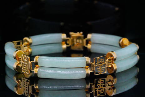 22mm Green Jade and 14K Yellow Gold 7.25" Bracelet: 22mm Green Jade and 14K Yellow Gold 7.25" Bracelet - This bracelet has a double row design with 14k yellow gold auspicious characters and 22mm green jade barrels. Measurements: 7.25" length. Condition