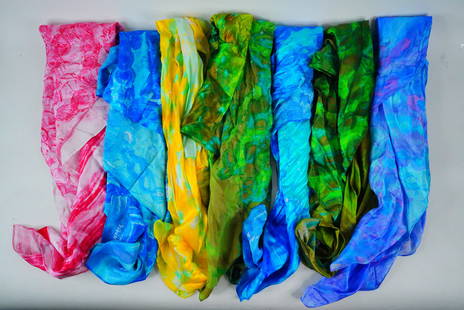Lot of (7) 100% Silk Scarves: Lot of (7) 100% Silk Scarves - This is a lot of (7) luxurious 100% silk scarves, each showcasing unique patterns and vibrant colors. This elegant assortment is perfect for accessorizing, collecting, o