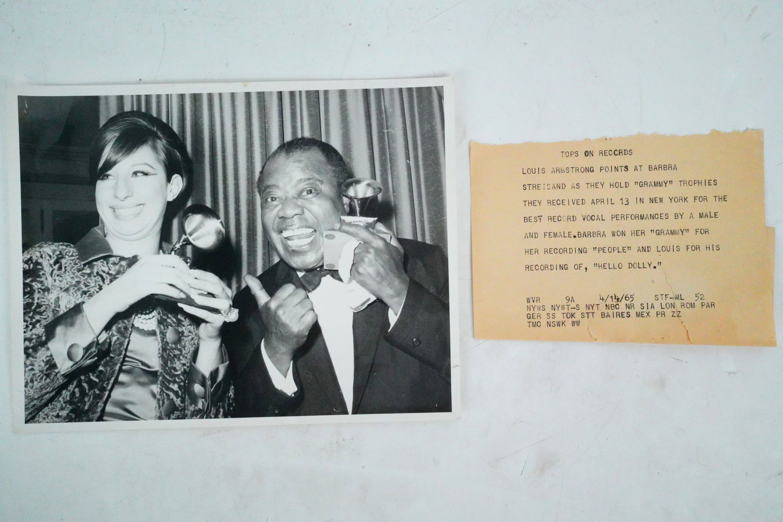 Barbra Streisand, Louis Armstrong 1965 Grammy Press Photo: Barbra Streisand and Louis Armstrong Original 1965 Grammy Press Photo, Wide World Photos - This rare and historic original press photograph captures an iconic moment between two of the most legendary