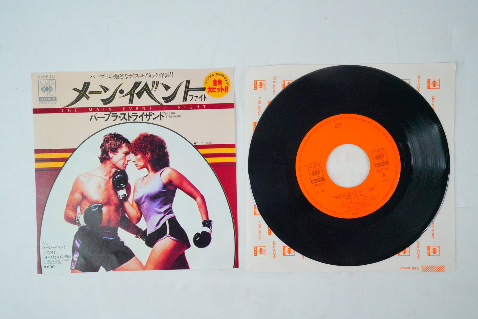 Rare Intl Japan The Main Event 45 Vinyl: Rare Intl Japan The Main Event 45 Vinyl - This lot features a rare international Japan-exclusive release of Barbra Streisand's 1979 medley single "The Main Event/Fight" from the 1979 sports-romance fi