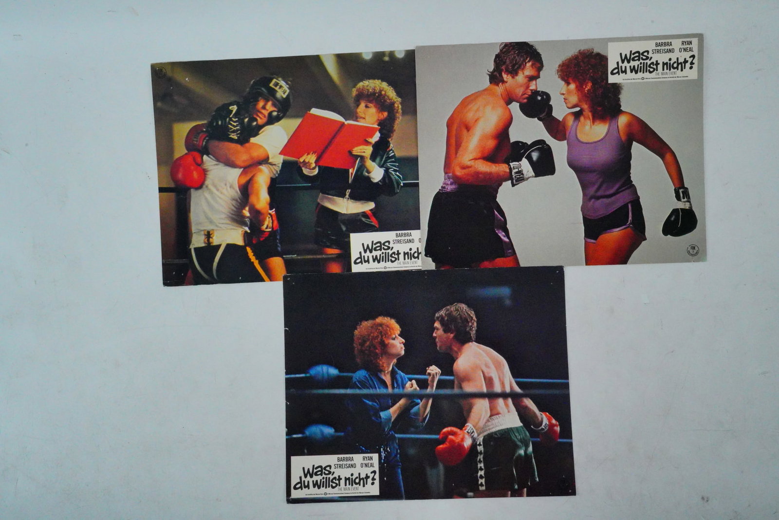 The Main Event (1979) Lot of (3) German Lobby Cards: The Main Event (1979) Lot of (3) German Lobby Cards - This lot features three (3) original German lobby cards from the 1979 romantic comedy The Main Event, starring Barbra Streisand and Ryan O'Neal. A