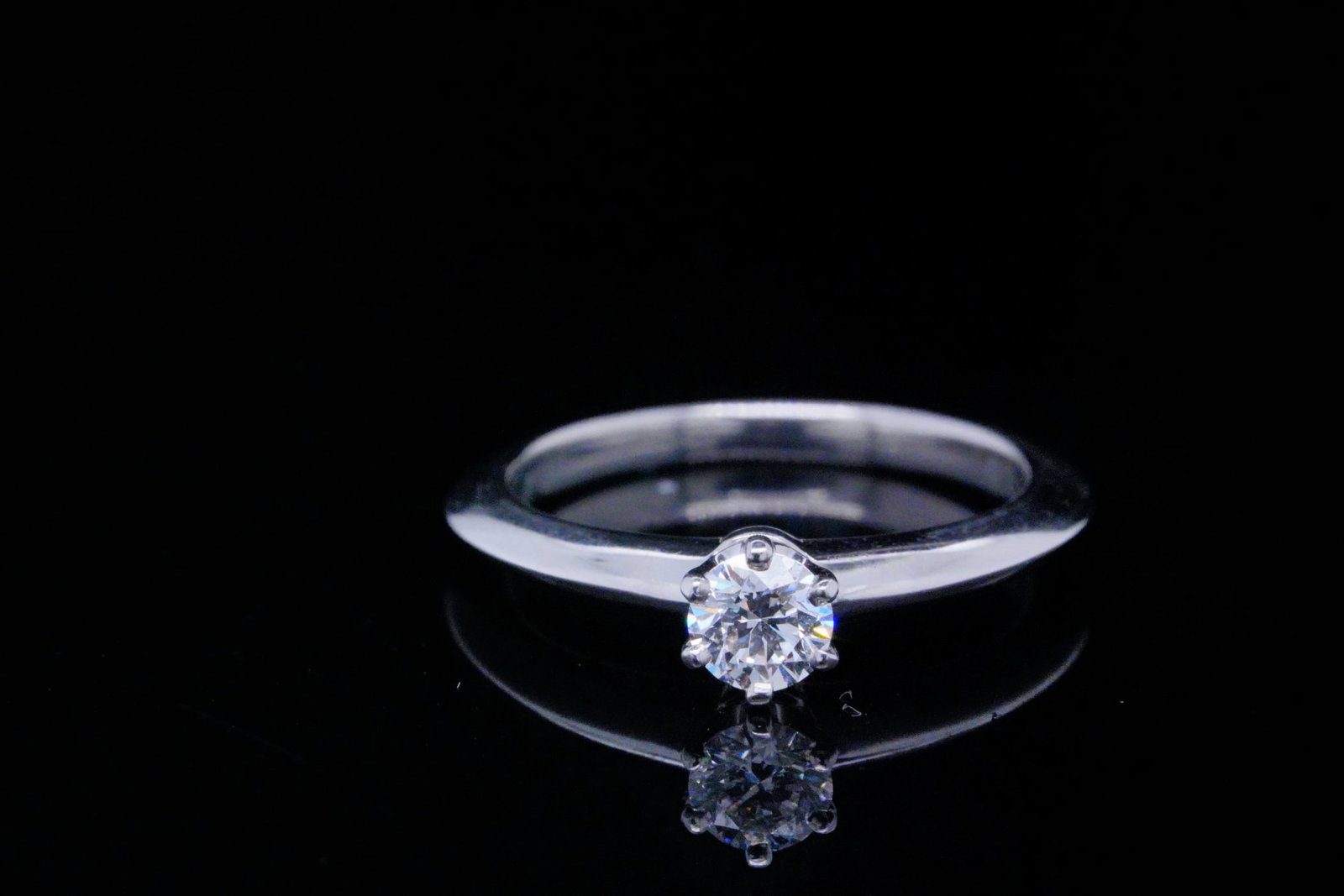 Tiffany & Co. 0.22ct VS2/F-G Diamond Platinum Ring: Tiffany & Co. 0.22ct VS2/F-G Brilliant Round-Cut Diamond Solitaire in 2mm Solid Platinum Band - This stunning ring was made by Tiffany & Co., and is made of solid platinum. The ring boasts a beautiful