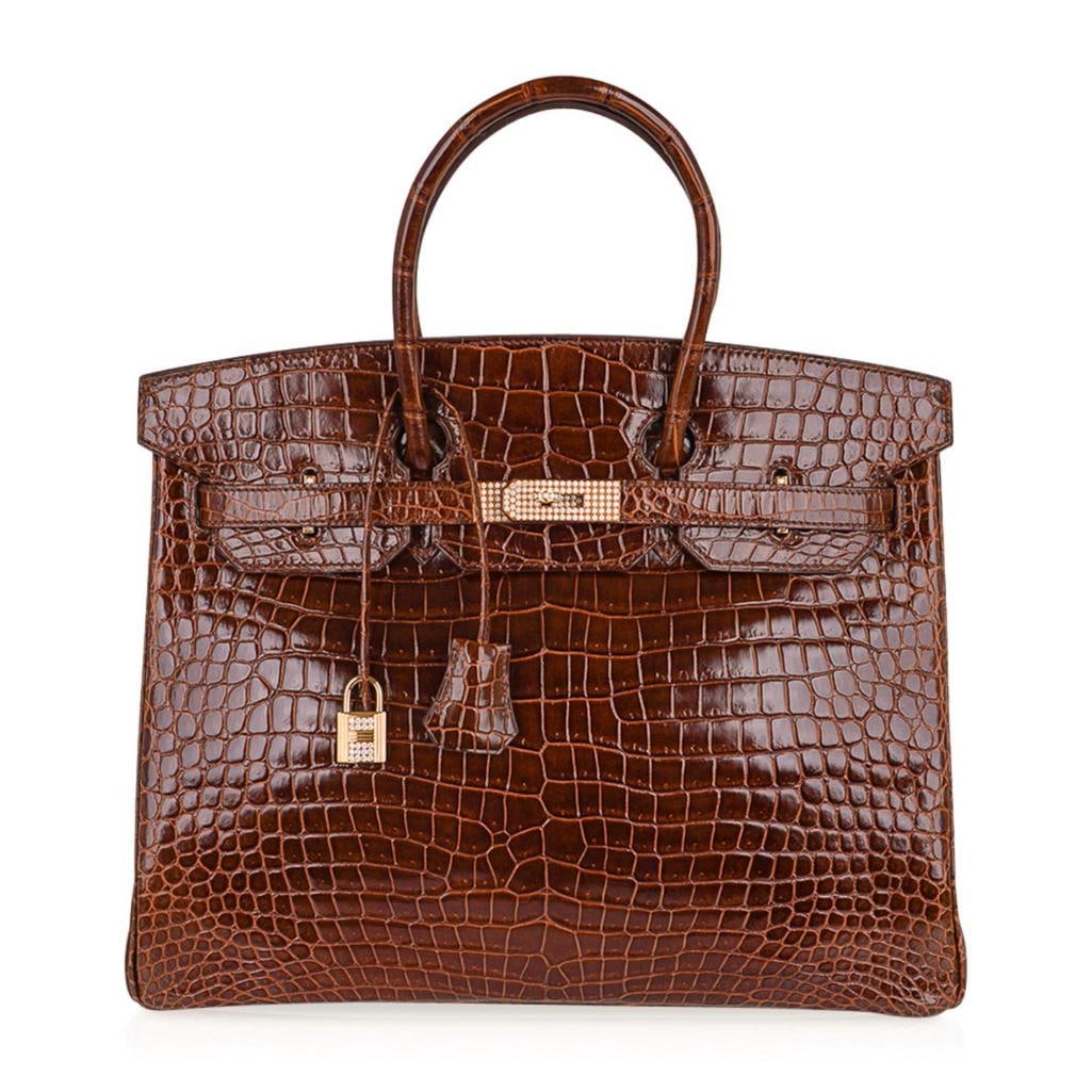Hermes Miel Porosus Crocodile, 10.23ctw Diamond 18K Birkin 35: Hermes Shiny Miel Porosus Crocodile, 10.23ctw Diamond and 18K Yellow Gold Limited Edition Birkin 35 W/Dust Cover and Rain Protector - Guaranteed Authentic - This exceptional handbag from Hermes is the