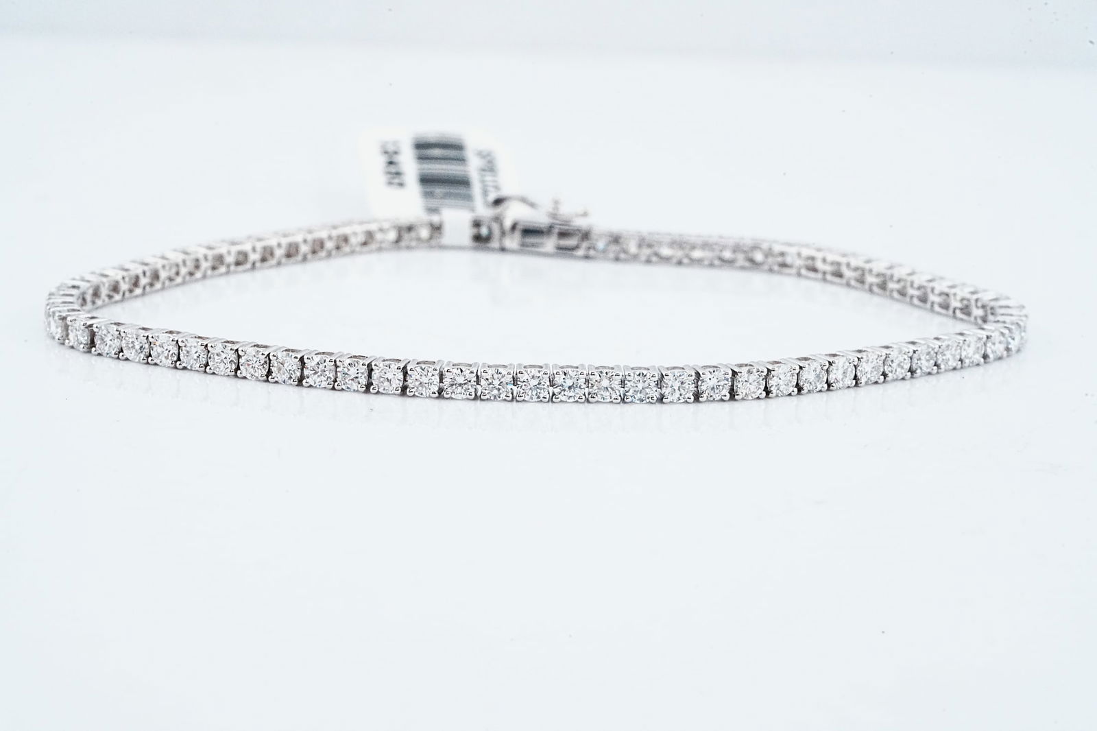 3.07ctw Lab Grown Diamond and 14K White Gold Bracelet: 3.07ctw VS1-VS2/G-H Lab Grown Diamond and 14K White Gold 7" Tennis Bracelet - A classic and versatile tennis bracelet featuring a continuous line of round brilliant lab grown diamonds totaling 3.07 ca