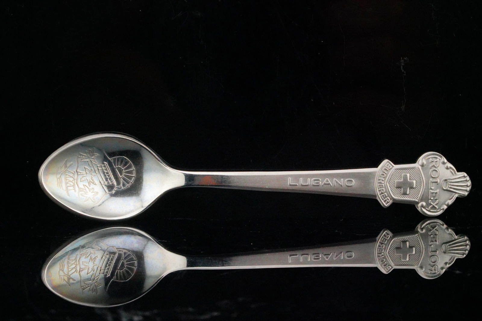 Rolex Bucherer of Switzerland Commemorative Spoon: Rolex Bucherer of Switzerland Commemorative Spoon - This finely crafted commemorative spoon features prominent branding from Rolex and Bucherer, celebrating their historic association in Lugano, Switz