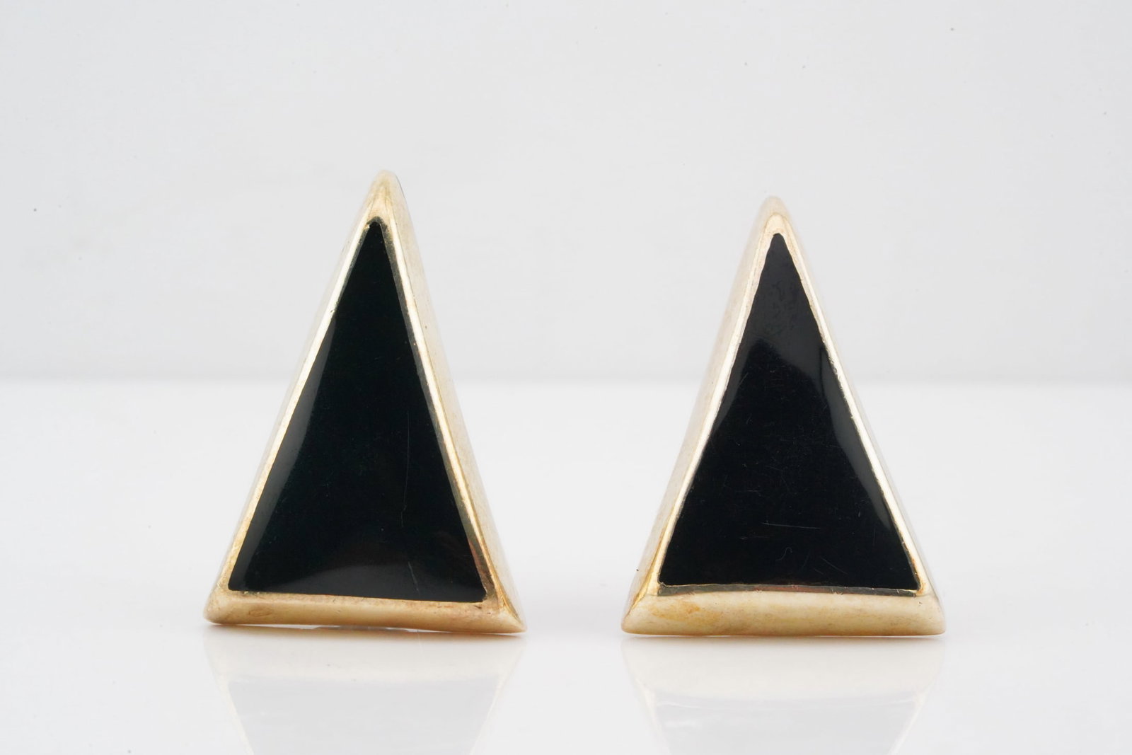 Sterling Silver and Black Enamel 1.25" Ear Clips: Sterling Silver and Black Enamel 1.25" Ear Clips - These striking ear clips are crafted in sterling silver and feature an elongated triangular form filled with glossy black enamel. The bold geometric