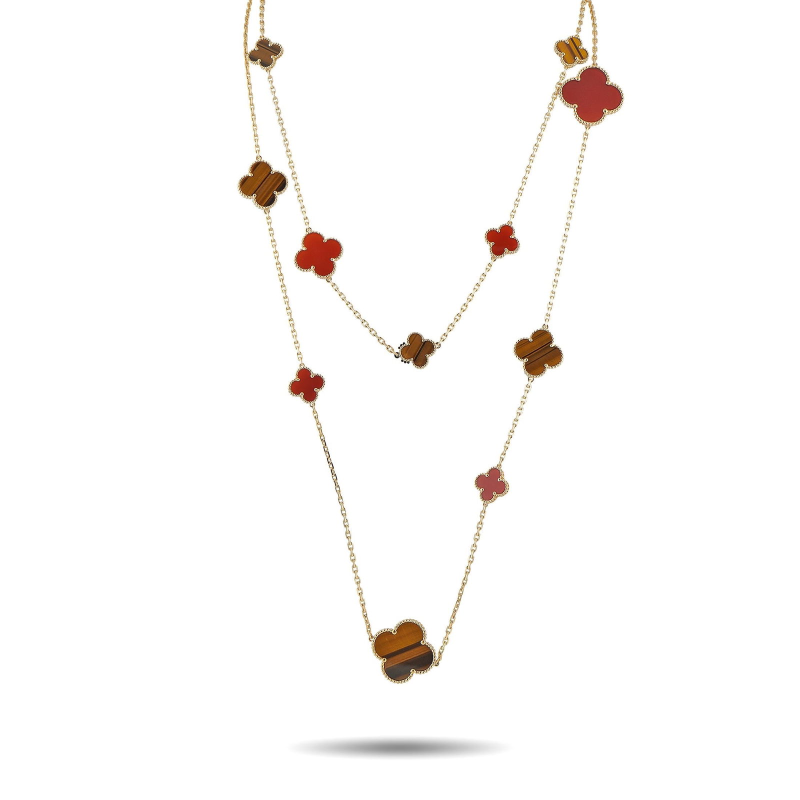 Van Cleef & Arpels 18K, Carnelian, Tiger's Eye Necklace: Van Cleef & Arpels Alhambra 18K Yellow Gold, Carnelian and Tiger's Eye 16-Motif Necklace - A striking interpretation of Van Cleef & Arpels iconic Alhambra design, this necklace features 16 clover moti