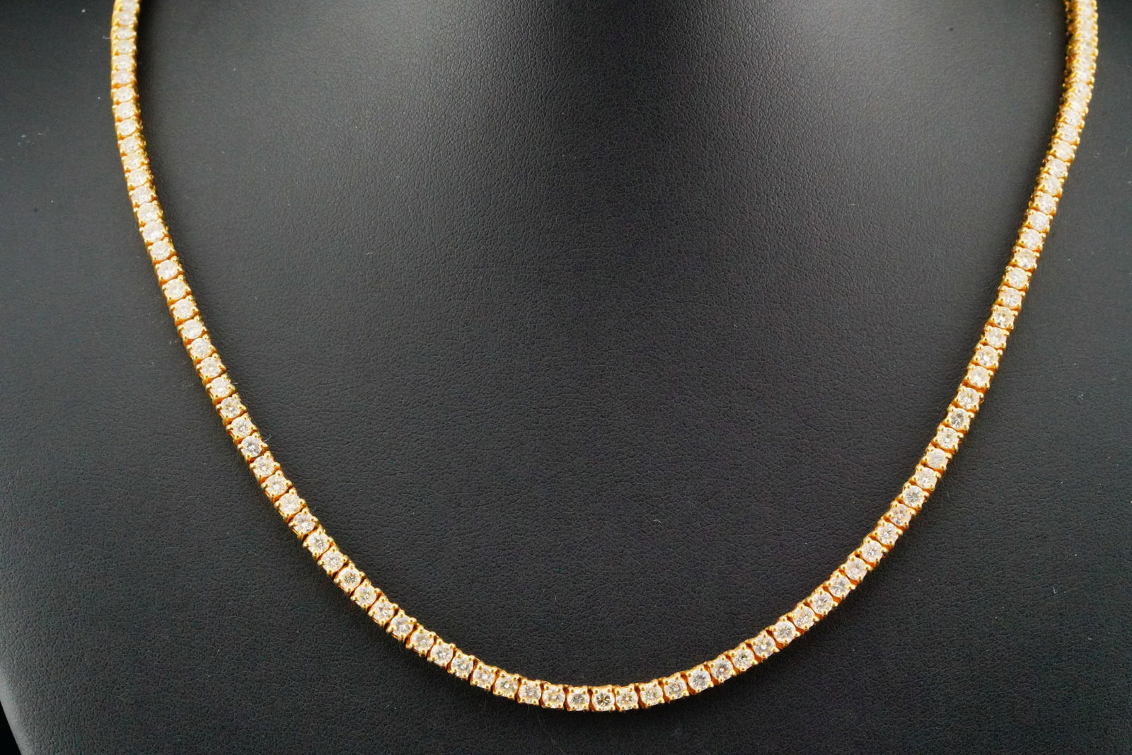 16.00ctw SI1-SI2/G-H Diamond and 14K Tennis Necklace: 16.00ctw SI1-SI2/H-J Diamond and 14K Yellow Gold 24" Tennis Necklace - This impressive tennis necklace is set with approximately 16.00 carats total weight of round brilliant-cut diamonds, evenly