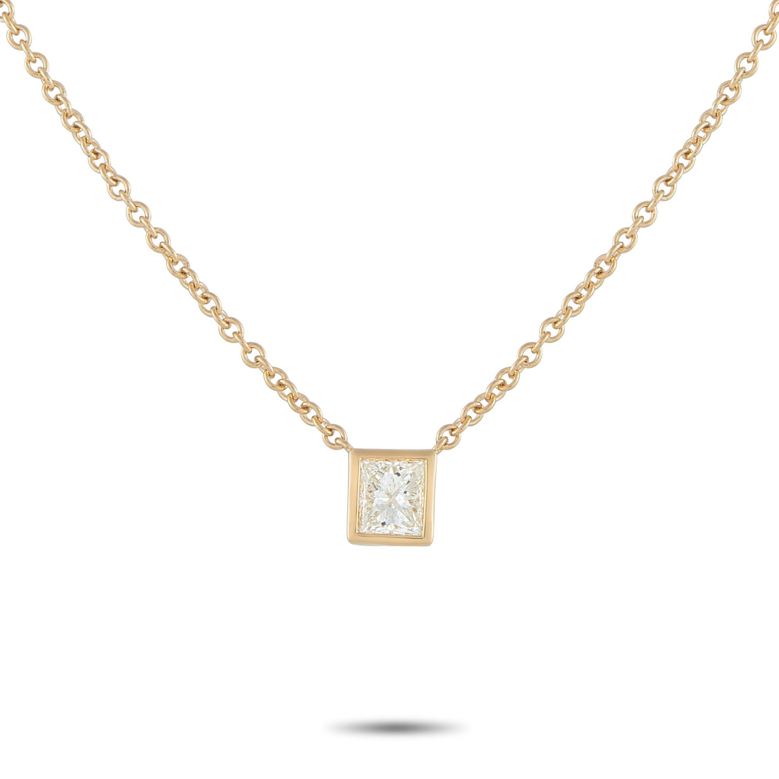 18K Yellow Gold and 0.60ct Princess Cut Diamond Necklace: 18K Yellow Gold and 0.60ct Princess Cut Diamond Solitaire Necklace - Minimalist and beautifully refined, this solitaire necklace is an ideal choice for everyday elegance. A crisp princess-cut diamond