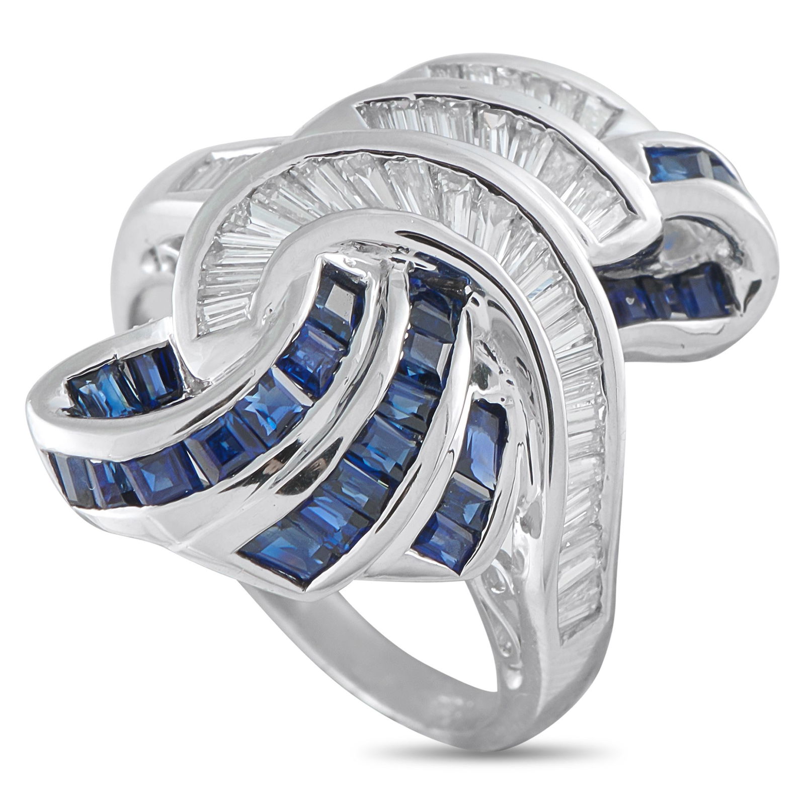 1.30ctw Sapphire, 0.75ctw Diamond and Platinum Ring: 1.30ctw Blue Sapphire, 0.75ctw Diamond and Platinum Ring - Bold and elegantly sculpted, this striking ring is designed to command attention on the hand. The centerpiece is formed by two opposing, swee