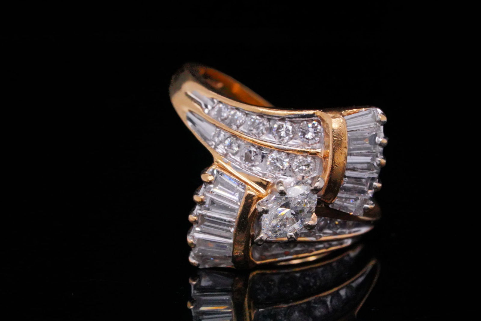 1.50ctw SI1-SI2/G-H Diamond and 14K Yellow Gold Ring: 1.50ctw SI1-SI2/G-H Diamond and 14K Yellow Gold Ring - This elegant 14K yellow gold ring features a sculptural, vintage-inspired design highlighted by a marquise-cut center diamond weighing