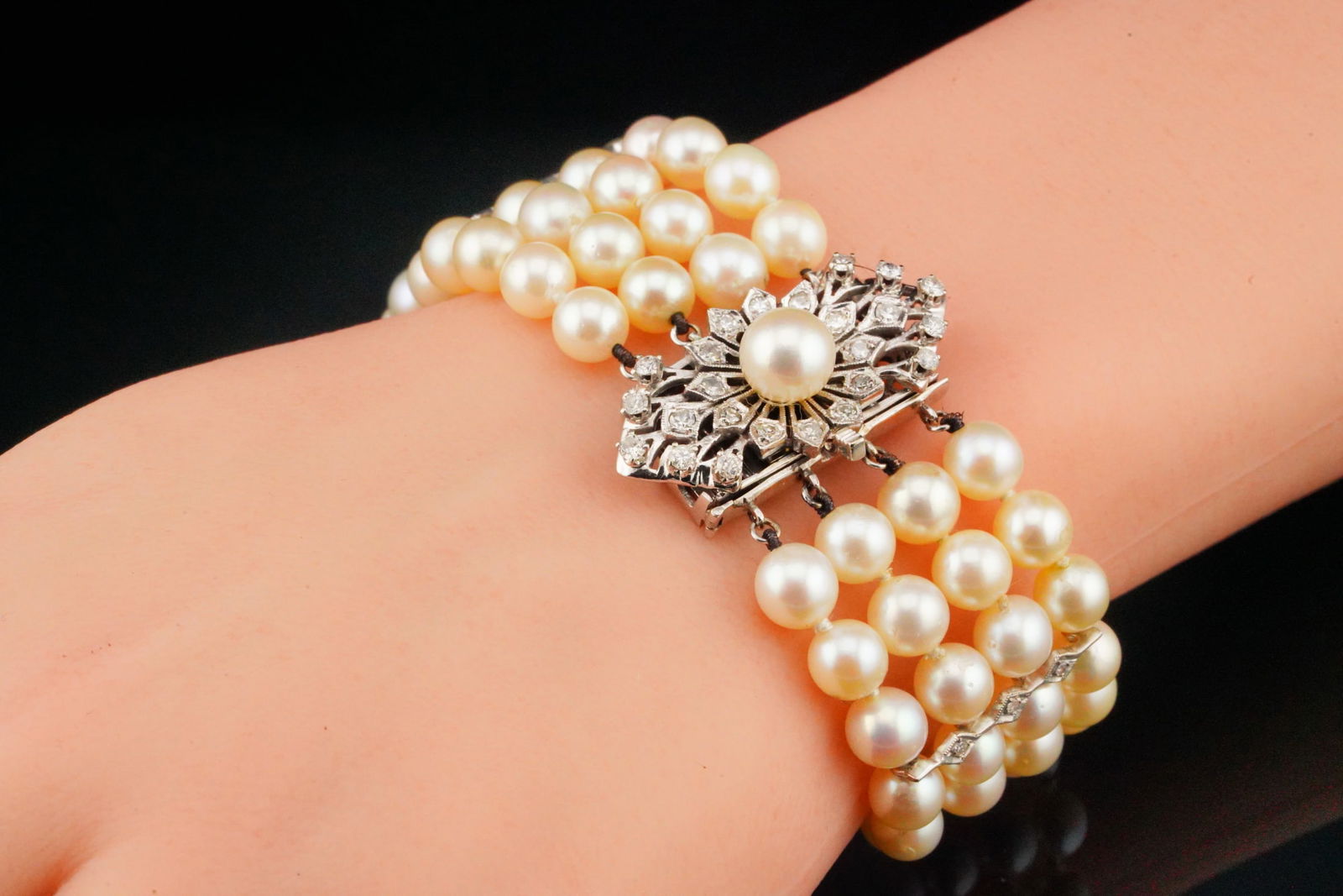 1.00ctw Diamond, 6mm-6.5mm Pearl and 14K 7.25" Bracelet: 1.00ctw Diamond, 6mm-6.5mm Pearl and 14K White Gold 7.25" 4-Row Bracelet - This elegant bracelet features four strands of luminous cultured pearls measuring approximately 6mm-6.5mm in diameter. The