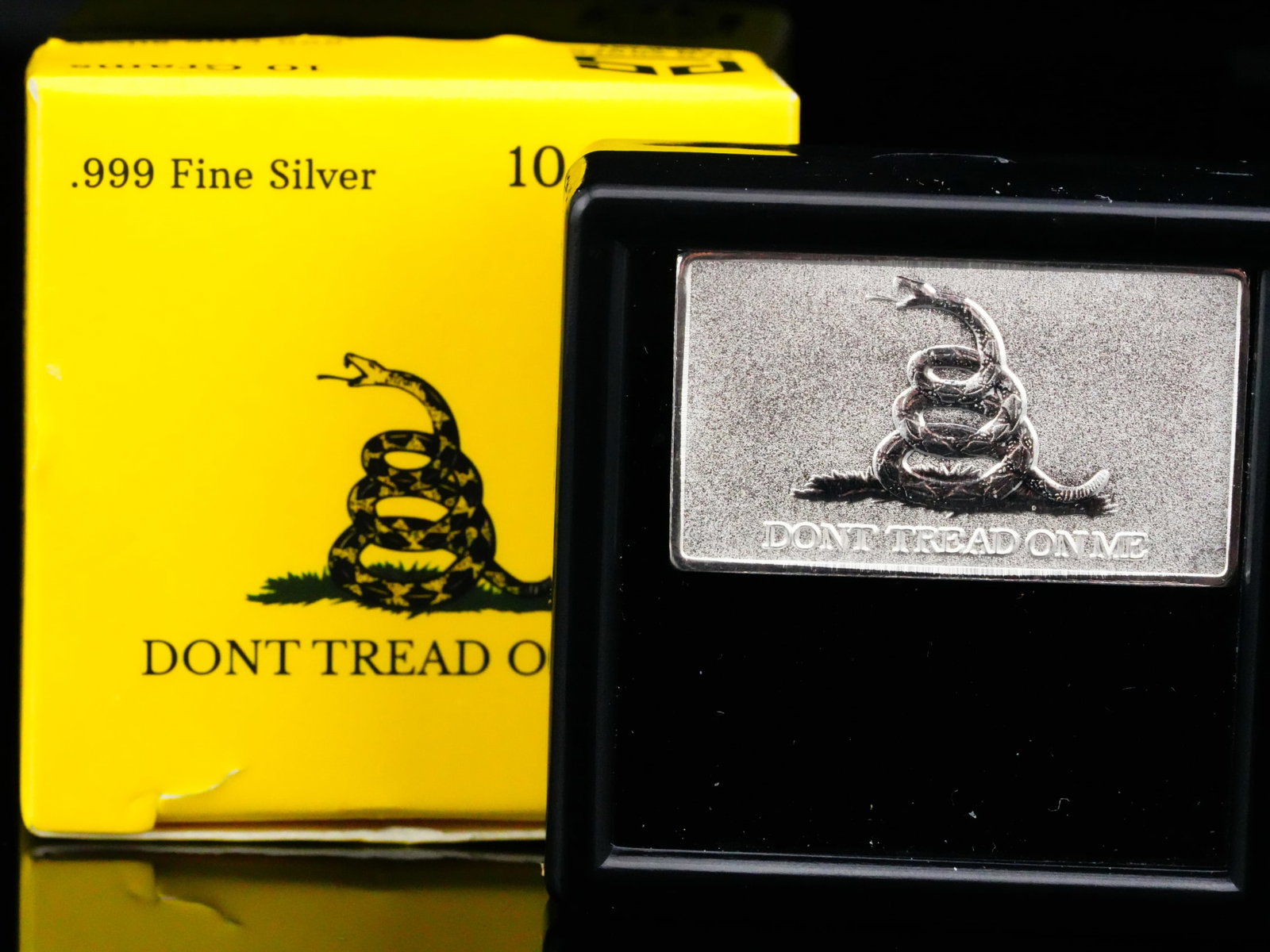 10 Gram .999 Fine Silver "Don't Tread on Me" Bar: 10 Gram .999 Fine Silver Pan Silver Co. "Don't Tread on Me" Silver Bar W/Original Box - This collectible 10 gram .999 fine silver bar was produced by Pan Silver Co. and features the iconic 'Don't Trea
