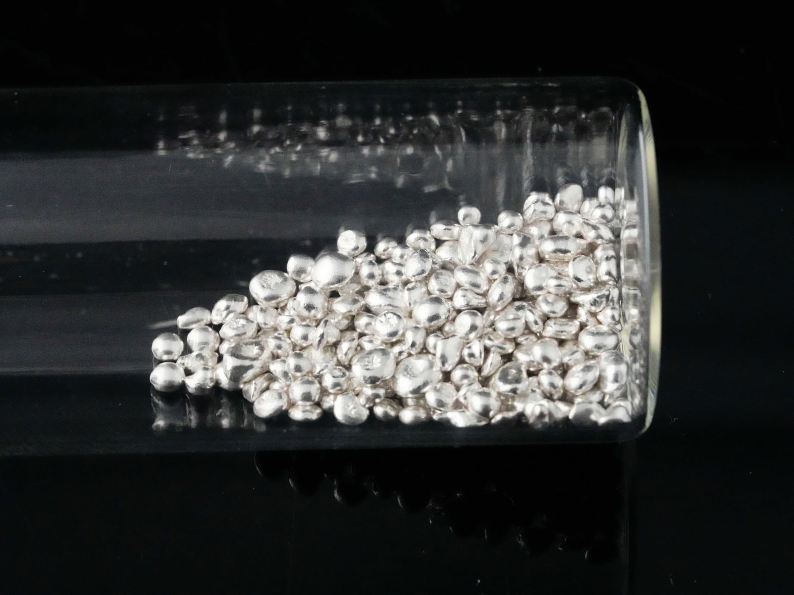 24.5 Grams .999 Silver Beads: 24.5 Grams .999 Silver Beads - Offered here is a lot of 24.5 grams of .999 fine silver beads, neatly housed in a clear glass jar for easy storage and display. These bright, high-purity silver beads ar