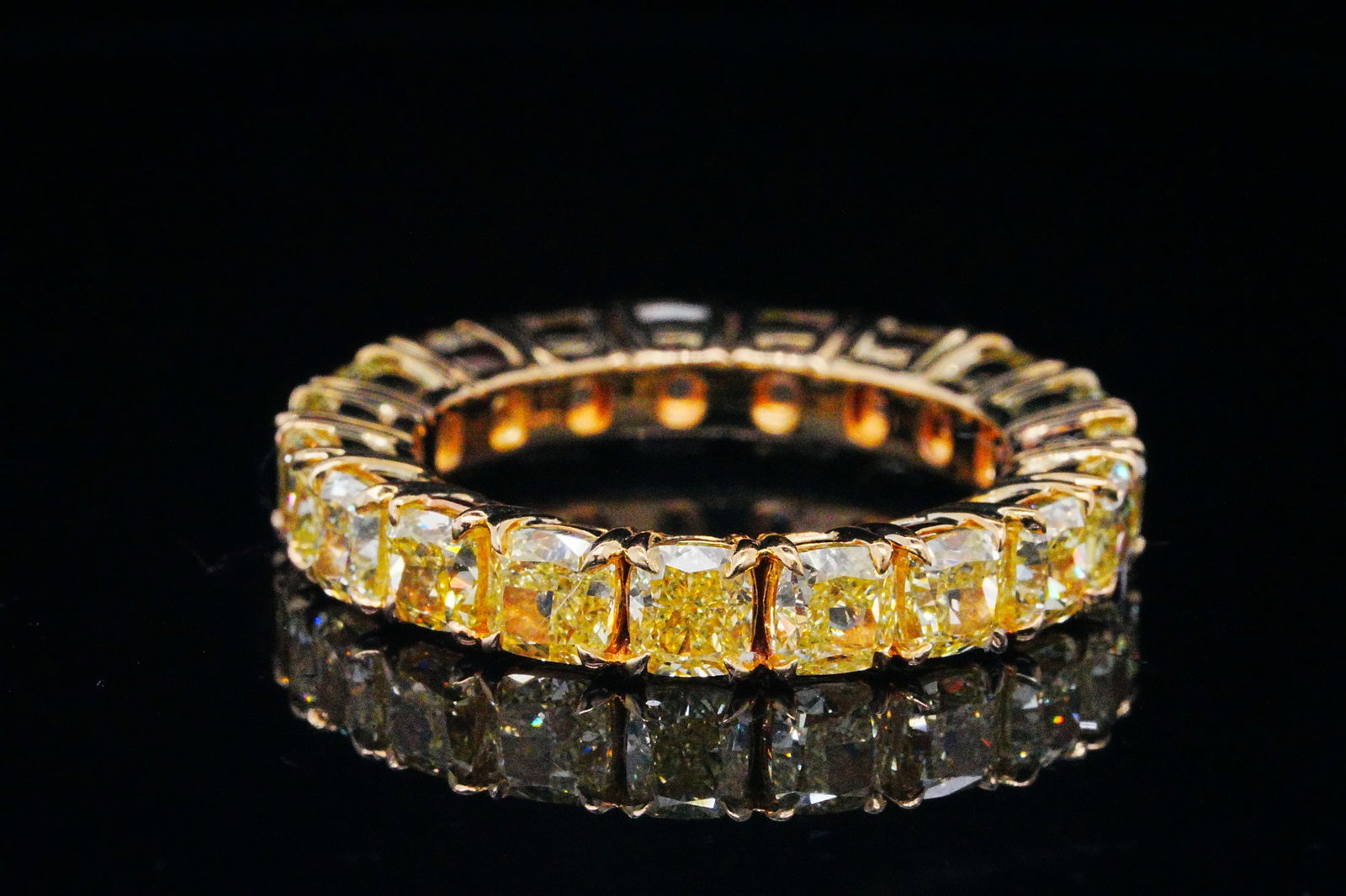 7.00ctw VS2-SI1 Yellow Diamond 18K Eternity Band: 7.00ctw VS2-SI1 Cushion Cut Yellow Diamond Solid 18K Yellow Gold 4.5mm Wide Eternity Band - THIS ITEM WILL COME WITH A $39,000 INSURANCE VALUATION REPORT IN THE WINNING BIDDER'S NAME. This beautiful r