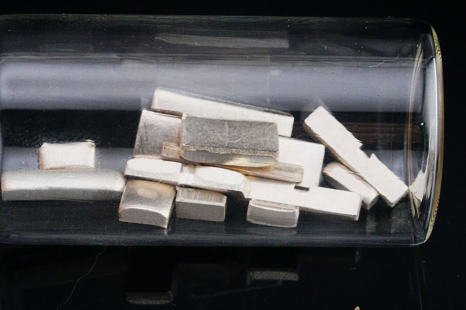 20.4 Grams .999 Solid Silver Mini Bars: 20.4 Grams .999 Solid Silver Mini Bars - Offered here is a lot of 20.4 grams of .999 fine silver mini bars, neatly housed in a clear glass jar for easy storage and display. These bright, high-purity s
