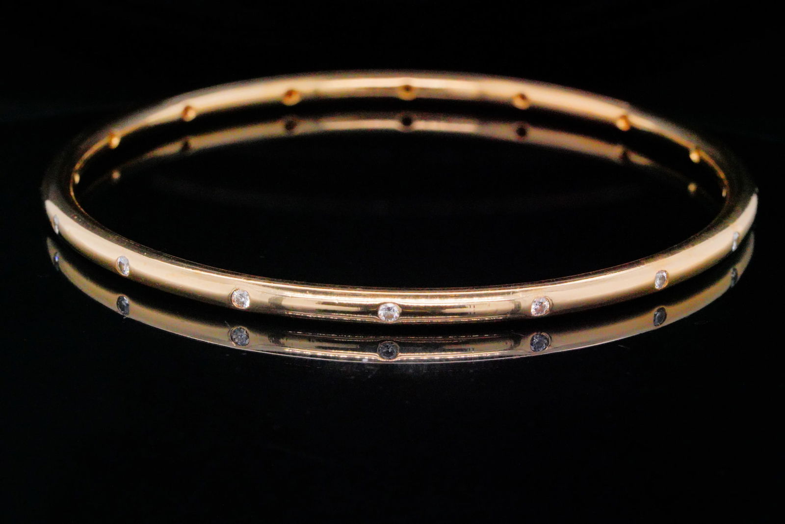 20K Yellow Gold and 0.30ctw Diamond 3.3mm Wide Bangle: 20K Yellow Gold and 0.30ctw Diamond 3.3mm Wide Bangle - This elegant bangle is crafted in rich 20K yellow gold and set with approximately 0.30 carats of sparkling diamonds that add a refined touch of