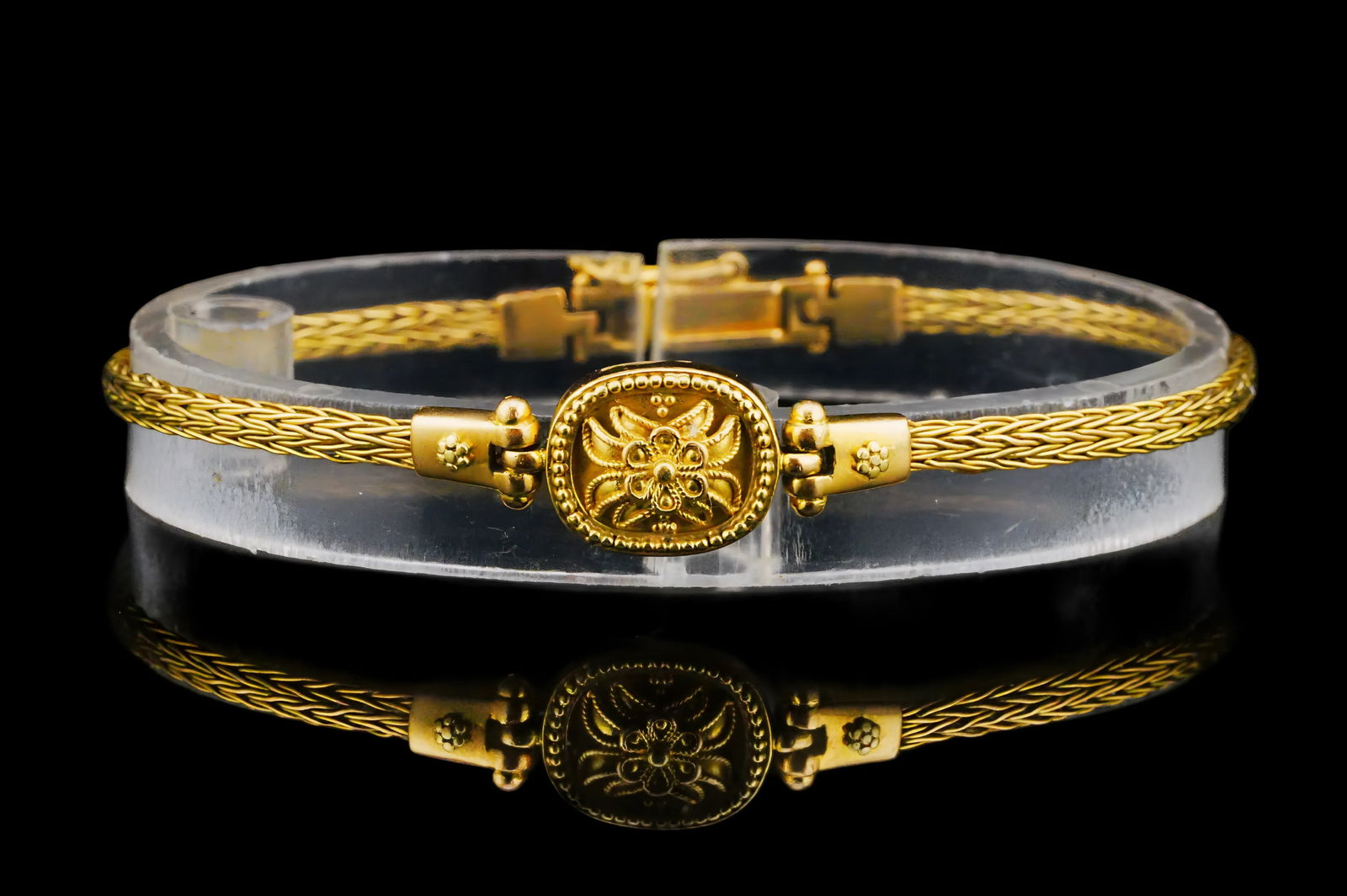 Vintage 18K Yellow Gold 7" Bracelet: Vintage 18K Yellow Gold 7" Bracelet - This lovely vintage bracelet is crafted in 18k yellow gold and features a woven gold bracelet finished with an oval form in the center decorated with a high