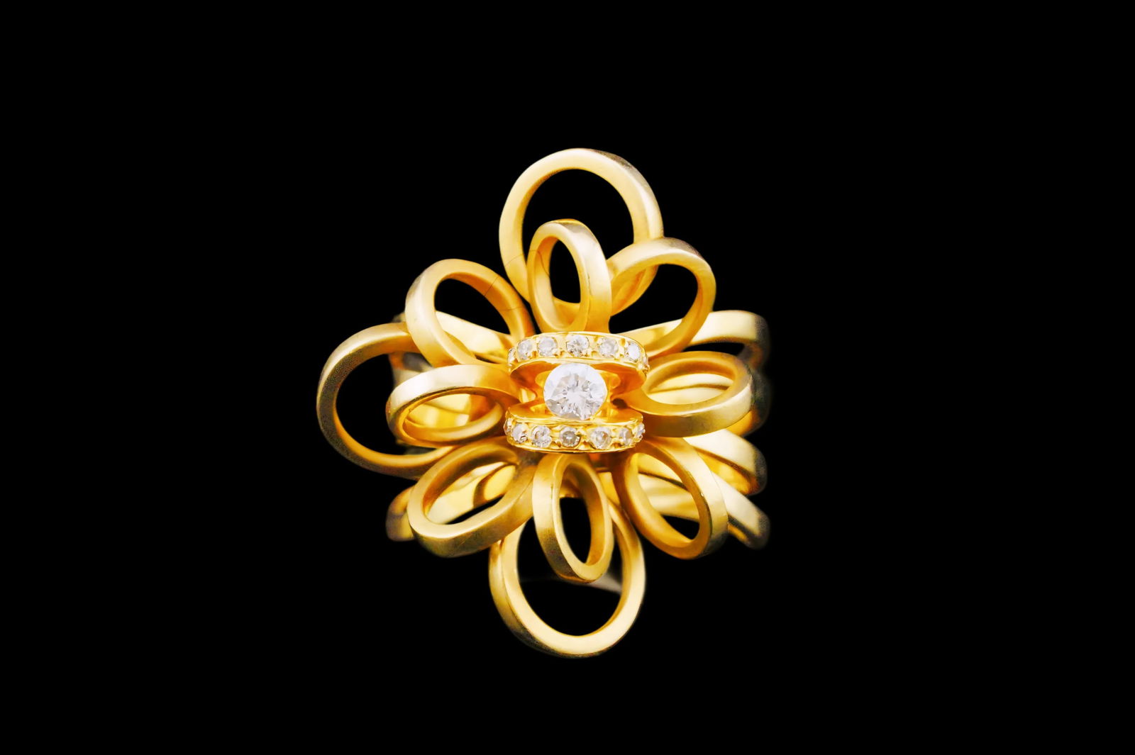 18K Yellow Gold Diamond Accented Floral Cluster Ring: 18K Yellow Gold Diamond Accented Openwork Floral Cluster Ring - This ring features an approximately 0.10ct round brilliant-cut diamond center set within sculptural looping ribbons of 18k yellow gold,