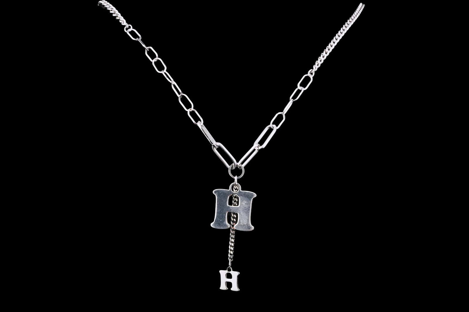 Solid Platinum 19" H Pendant Necklace: Solid Platinum 19" H Pendant Necklace - This necklace is crafted in platinum and features two hanging H-shaped pendants. The necklace measures 19 inches in total length and also has two additional jum