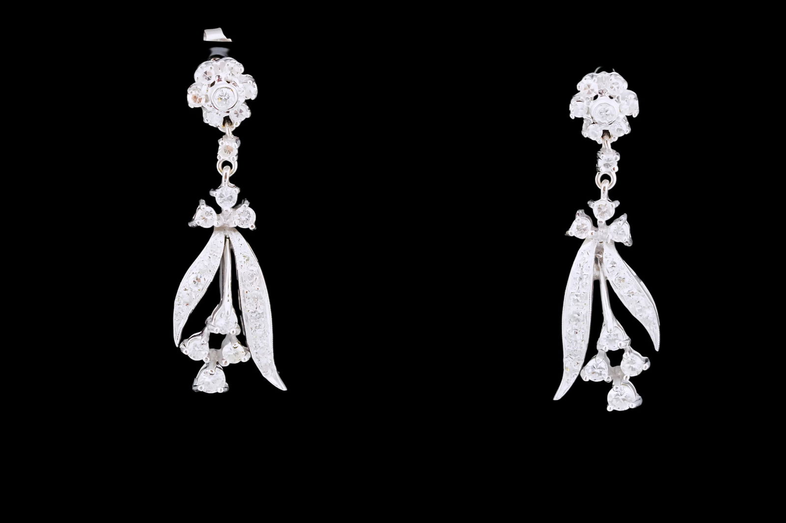 1.30ctw SI1-SI2/G-H Diamond and 14K 1.10" Earrings: 1.30ctw SI1-SI2/G-H Diamond and 14K White Gold 1.10" Flower Drop Earrings - These lovely earrings are crafted in 14k white gold and are embellished with approximately 1.30ctw SI1-SI2/G-H fiery white