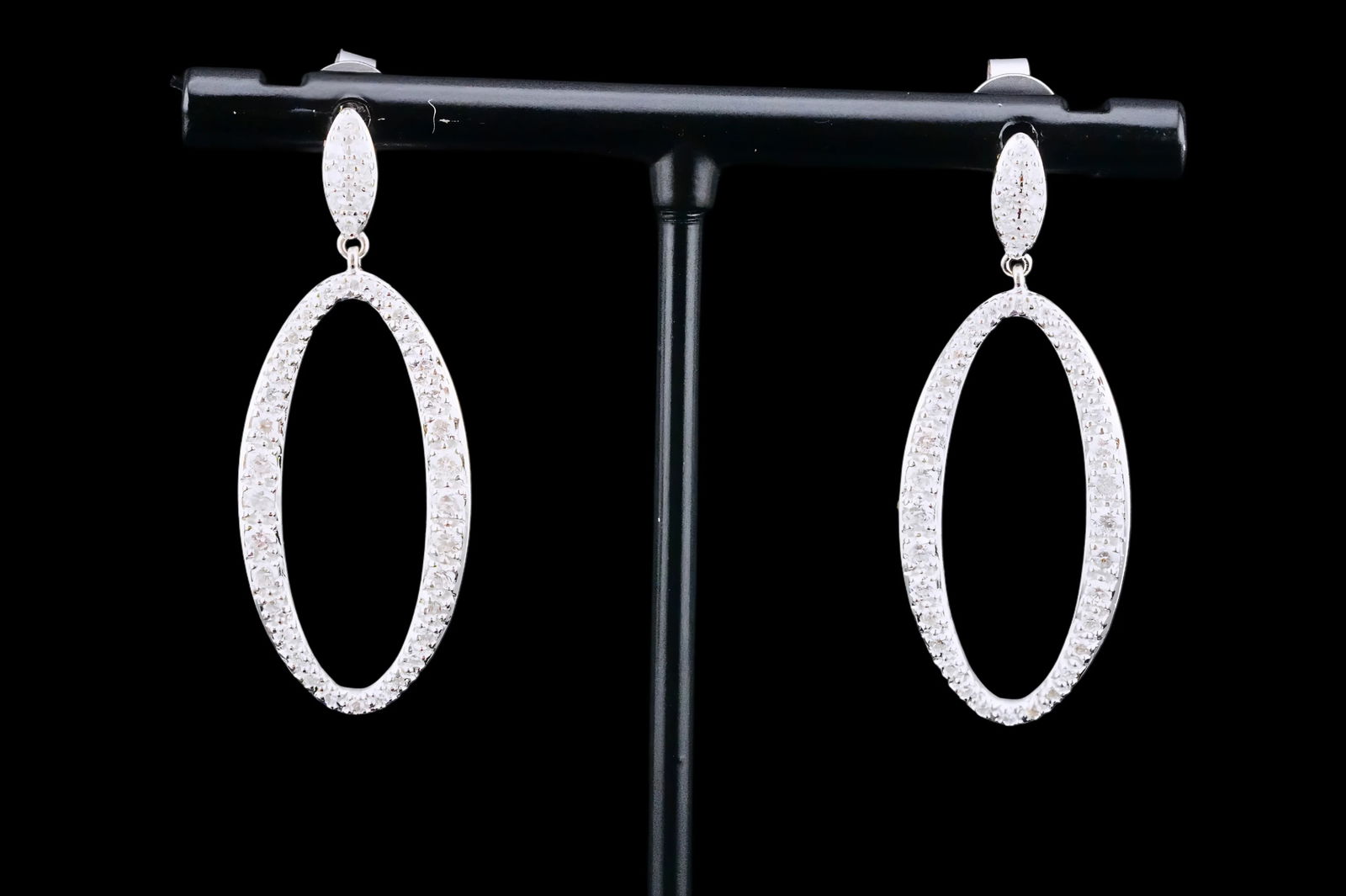 1.00ctw SI1-SI2/G-H Diamond and 14K 1.5" Earrings: 1.00ctw SI1-SI2/G-H Diamond and 14K White Gold 1.5" Drop Earrings - These elegant earrings are crafted in 14k white gold and are embellished with approximately 1.00ctw SI1-SI2/G-H pave set diamonds. M