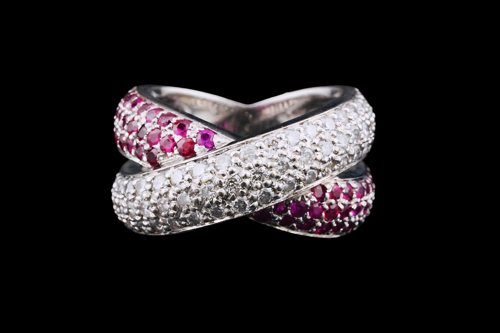 1.25ctw Diamond, 1.00ctw Ruby and 14K Ring: 1.25ctw SI1-SI2/G-H Diamond, 1.00ctw Ruby and 14K White Gold X Ring - Strikingly designed in 18K white gold, this elegant ring features a dynamic crisscross "X" motif set with vibrant rubies totaling