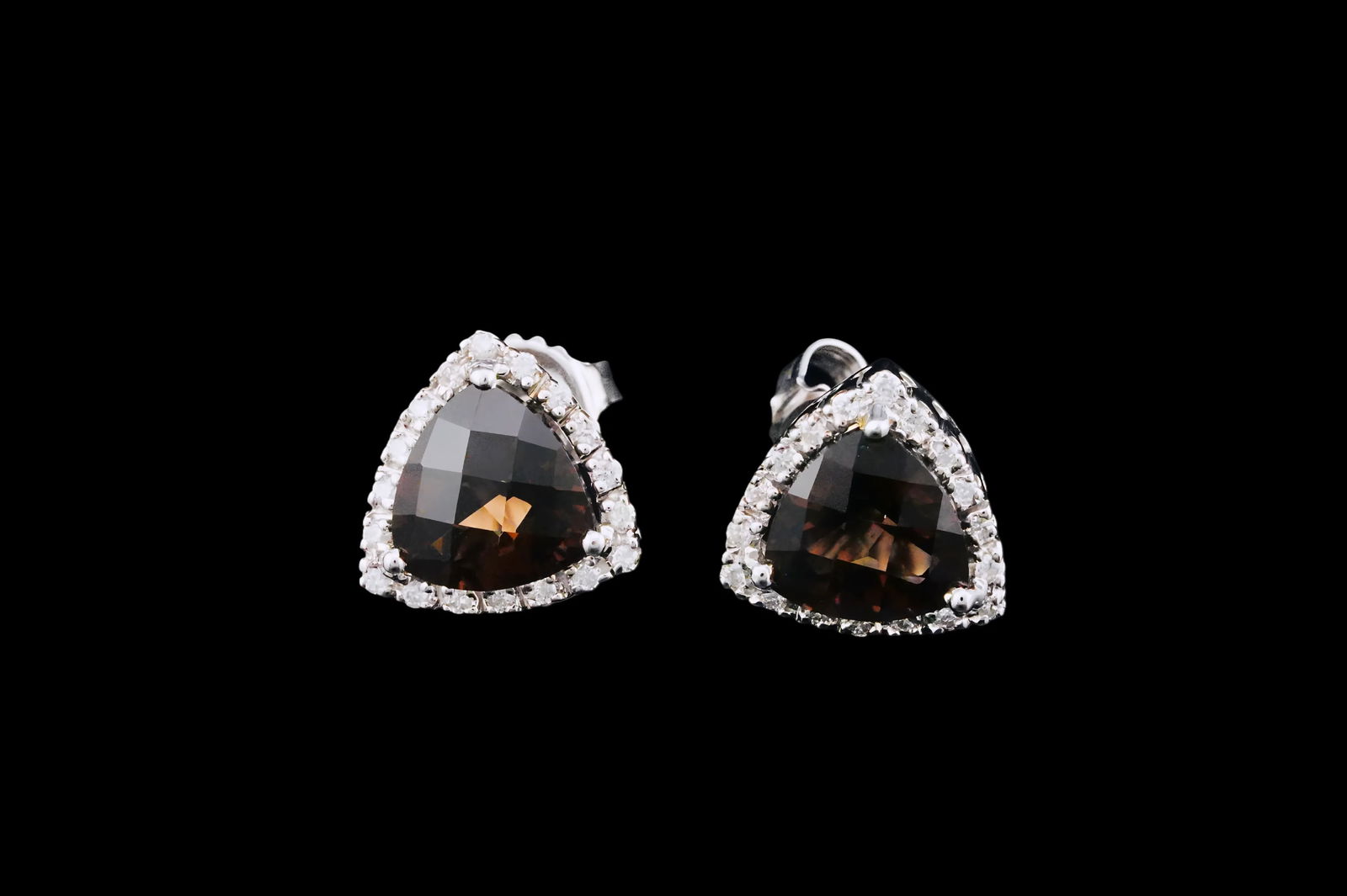 4.00ctw Smoky Quartz, 0.36ctw Diamond and 14K Earrings: 4.00ctw Smoky Quartz, 0.36ctw Diamond and 14K White Gold Stud Earrings - Stylish stud earrings with a rounded triangular design, each centered with a smoky quartz totaling approximately 4.00 carats wi