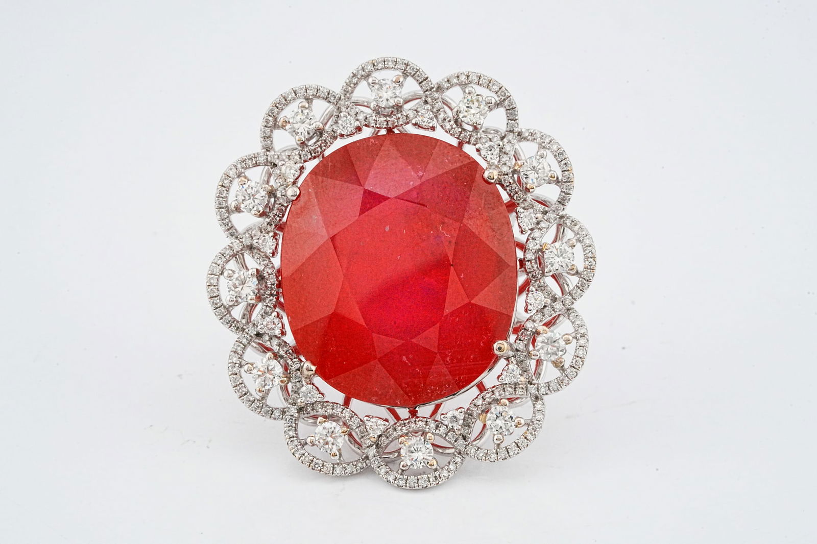 76.25ct Ruby, 1.75ctw Diamond and 18K White Gold Ring: 76.25ct Ruby, 1.75ctw VS1-SI1/G-H Diamond and 18K White Gold Statement Ring - This item will come with a $35,500 insurance valuation report in the winning bidder's name. An extraordinary and unmistaka